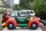 Mic-o-mic car next to a real car for dubster.com